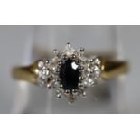 9ct gold sapphire and diamond cluster ring. Ring size O. Approx weight 2.6 grams. (B.P. 21% + VAT)