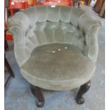 Early 20th Century upholstered button back tub chair on circular seat with carved oak scroll