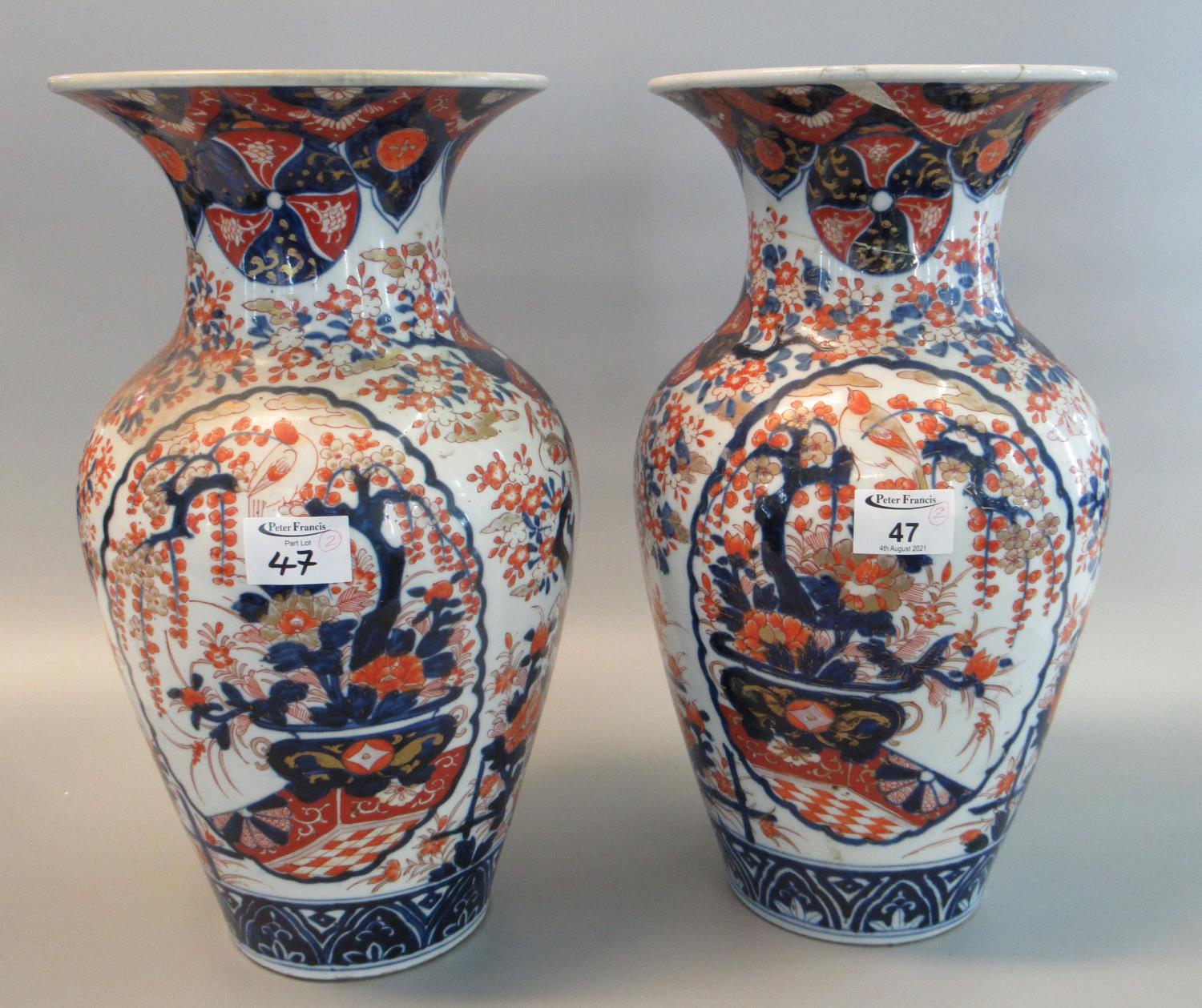 Pair of 19th Century Japanese Imari baluster shaped vases with flared necks, overall decorated in