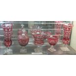 A collection of ruby flash cut glass items to include; pair of vases, pedestal centre bowl and two