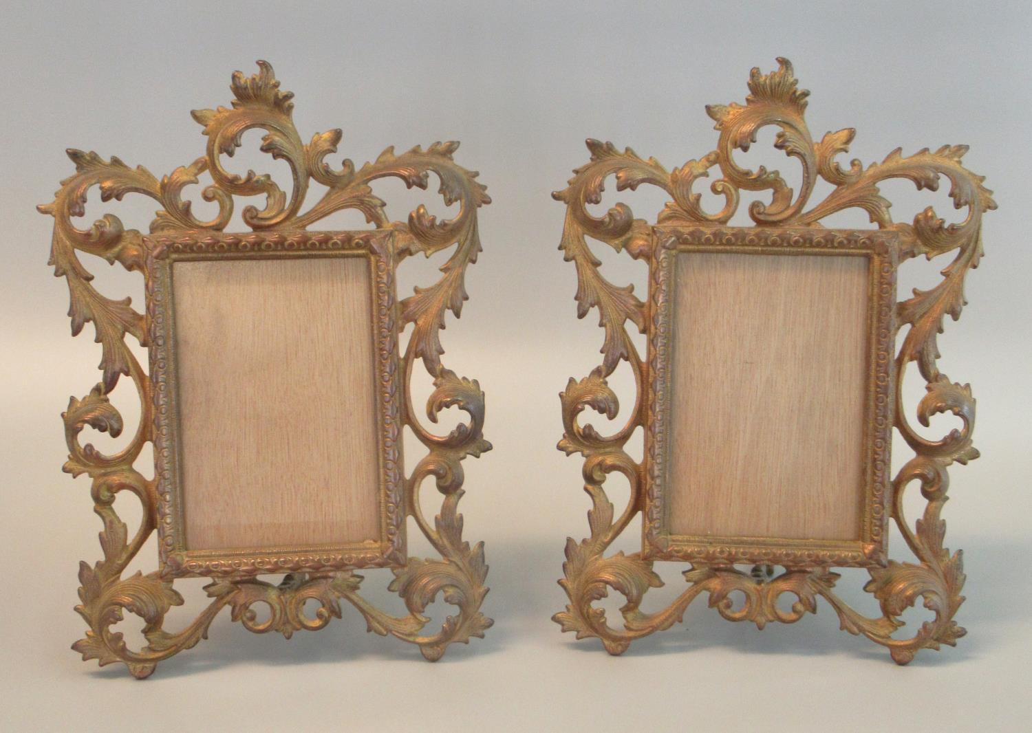 Pair of pierced foliate design gilt brass standing photograph frames with rectangular glazed