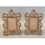 Pair of pierced foliate design gilt brass standing photograph frames with rectangular glazed