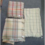 Three vintage woollen check blankets in various colours. One a narrow loom blanket. (3) (B.P.