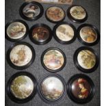 Box containing thirteen circular, wooden framed, ceramic wall plaques depicting portraits, country