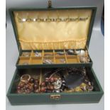 Jewellery box containing assorted costume jewellery, brooches, necklaces, coloured stones,