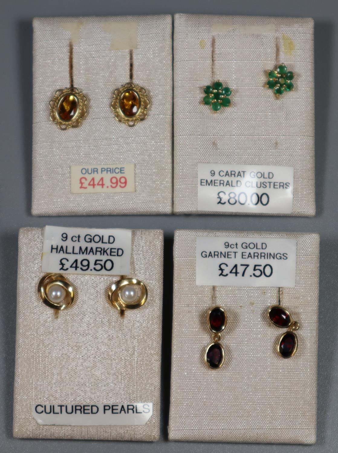 Four pairs of earrings set with citrine, garnet, diamond and pearl. (B.P. 21% + VAT)