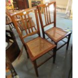 A pair of Edwardian mahogany inlaid bedroom chairs with cane seats on tapering legs. (B.P. 21% +