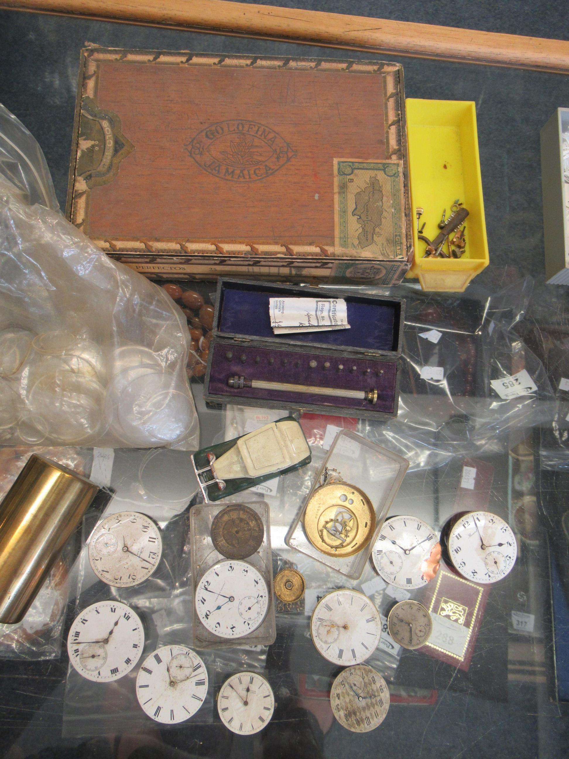 Display box containing mainly antique and other watch parts to include; pocket watch faces and - Image 3 of 5