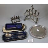 Victorian silver coaster, together with a silver four section toast rack, silver handled