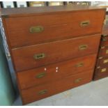 Campaign style two section straight front chest of four drawers with brass recessed handles and