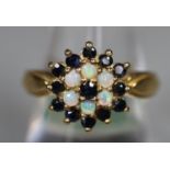 9ct gold opal and sapphire ring. Ring size N&1/2. Approx weight 3.6 grams. (B.P. 21% + VAT)