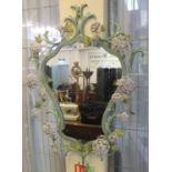 Unusual modern mirror, the metal frame decorated with foliage and flower heads. (B.P. 21% + VAT)