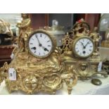 Two similar French gilt spelter drum head shaped mantel clocks, both figure mounted and with