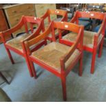 Set of four Scandinavian design stained open arm chairs with rush seats on tubular legs. (4) (B.P.