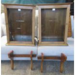 A pair of oak ecclesiastical wall display units, with single glazed door, glass shelves to the