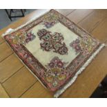 Small multi-coloured floral and foliate temple mat. 59 x 66cm approx. (B.P. 21% + VAT)