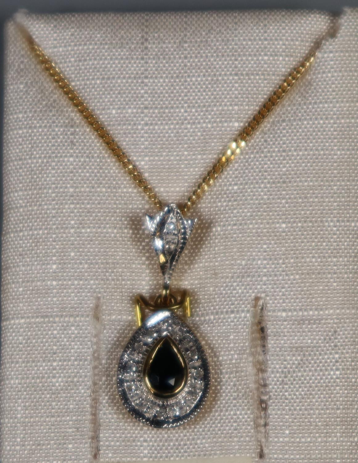 Sapphire and diamond pendant on a 9ct gold chain. (B.P. 21% + VAT)