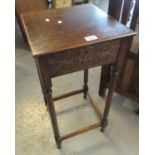 Early 20th Century oak lamp table of square form with carved foliate frieze on turned legs. (B.P.