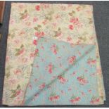 Late 19th/early 20th Century floral design cotton quilt with different floral patterns to each side.