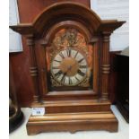 Early 20th Century German two train walnut cased mantel clock with brass face having Roman chapter