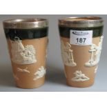 A pair of Royal Doulton stoneware topers beakers with silver rims, Lance Corp Brown 3rd D.C.O.V.B