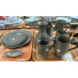 Two trays of probably 18th Century pewter items to include; pair of two handled trophy cups,