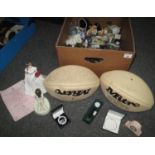 A box of assorted oddments including: two signed rugby balls, a Royal Minton figurine and a Royal