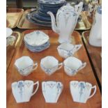 14 piece Shelley bone china coffee set decorated on a white ground with hand painted enamelled