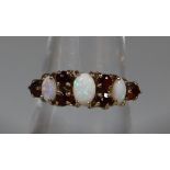 9ct gold Victorian design opal and garnet dress ring. 2.5g approx. (B.P. 21% + VAT)