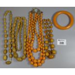 Collection of orange Bakelite and plastic jewellery. (B.P. 21% + VAT)