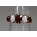 Victorian design 9ct gold opal and garnet dress ring. 3g approx. (B.P. 21% + VAT)