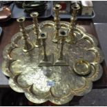 Large flower-shaped charger with Eastern style decoration, three pairs brass candlesticks, with a