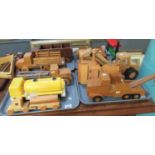 Four trays of scratch built wooden toy vehicles to include; pick up truck, lorries, steam engine