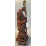 Chinese carved root wood figure of an immortal now as a table lamp, together with turned carved