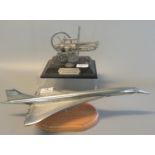 Diecast white metal study of the airliner Concorde on moulded wooden base. (B.P. 21% + VAT)