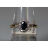 9ct gold sapphire and diamond cluster ring. Ring size P. Approx weight 3 grams. (B.P. 21% + VAT)