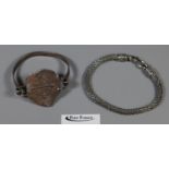 White metal snake bracelet and a hammered coin design bangle. (2) (B.P. 21% + VAT)