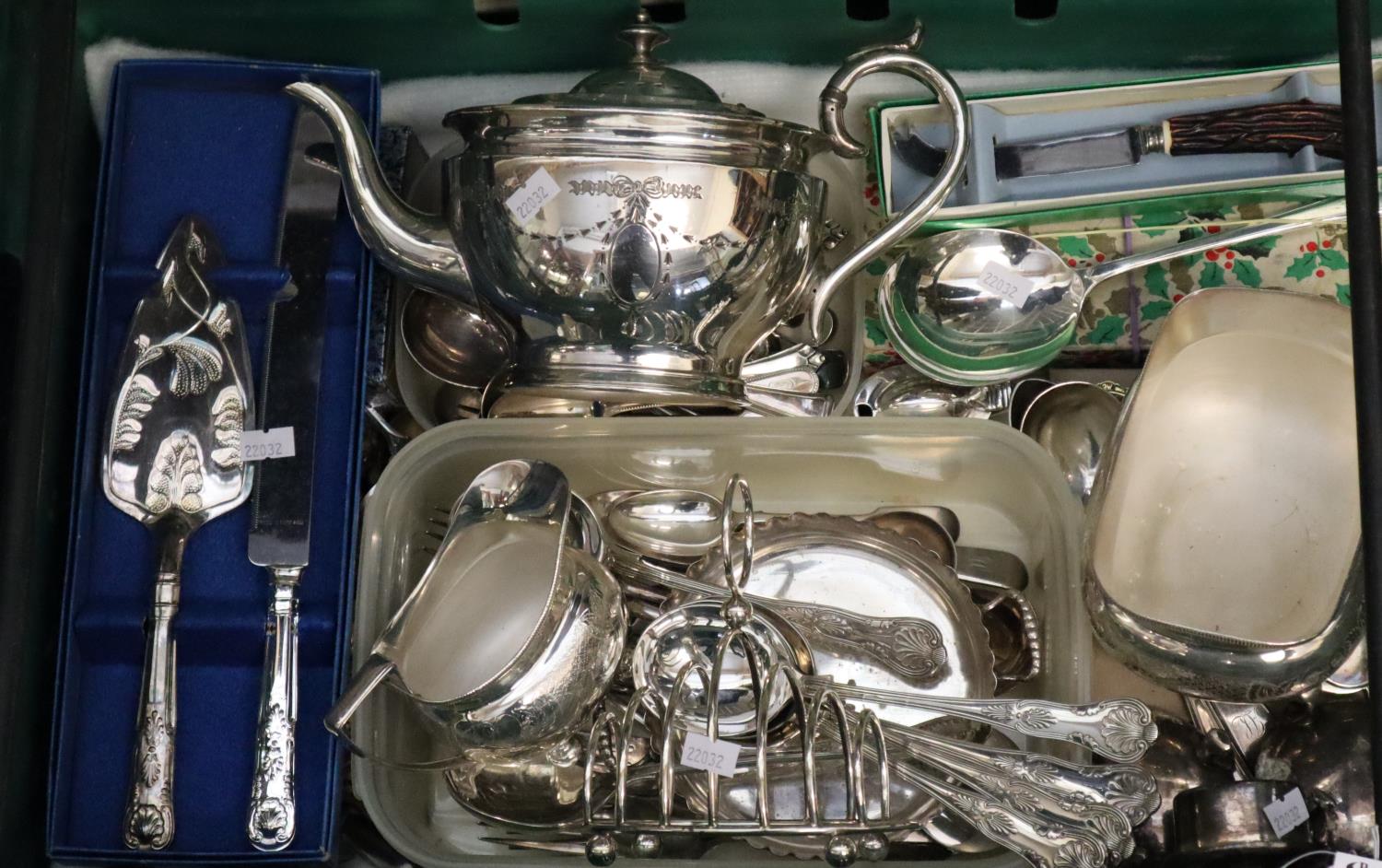 Plastic box of various silver plate top include three piece teaset, flatware, toast rack etc. (B.