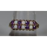 9ct gold Victorian design double row dress ring set with opals and purple stones. 2.1g approx. (B.P.