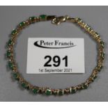 9ct gold emerald and diamond line bracelet stamped 10K. Approx weight 6 grams. (B.P. 21% + VAT)