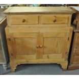Victorian pine two-stage blind panel cupboard with moulded top having two drawers, on bracket