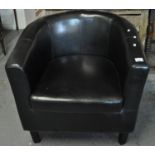 Modern black leather tub armchair. (B.P. 21% + VAT)