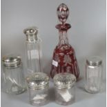 Collection of five silver-topped glass dressing table jars, together with a ruby flash cut, mallet-