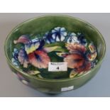 Moorcroft art pottery tube lined cream ground floral footed bowl, 19cm diameter approx. (B.P.