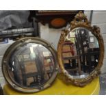 Modern oval mirror surmounted by cherubs and foliage, together with a convex type mirror. (2) (B.