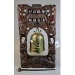 Chinese brass temple bell in carved and pierced dragon design wooden frame, with striker. 42cm