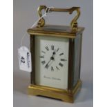 Small French gilt brass carriage clock with full depth Roman dial marked 'Swansea Goldsmiths',