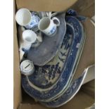 Box containing blue and white pottery items to include; willow design meat plates, large centre