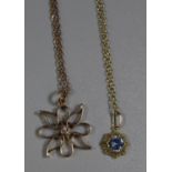 Diamond set pendant on a 14ct gold chain together with a 14ct gold blue zircon pendant. Approx