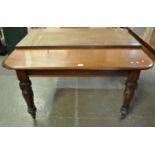 Victorian mahogany extending dining table with one additional leaf, standing on carved, tapering